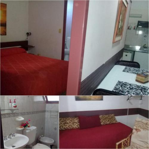 a hotel room with a red bed and a sink at Complejo turistico ALOJARTUR in San Rafael