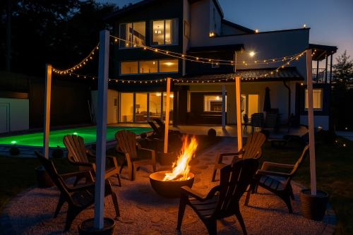 a fire pit in front of a house at night at Villa Kaplan Sarajevo in Gladno Polje