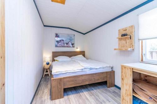 a bedroom with a bed in a room at BLE853-Holmsjoe-Aelmtamala-338 in Holmsjö