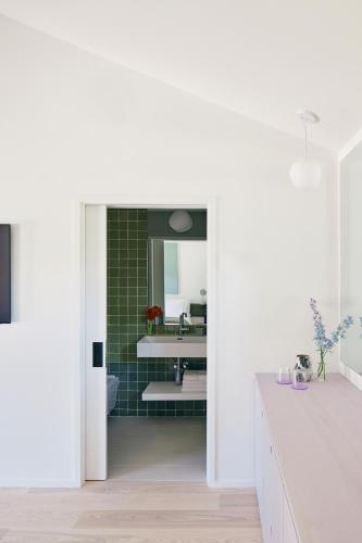 a bathroom with a sink and a mirror at Three Ducks in Westhampton