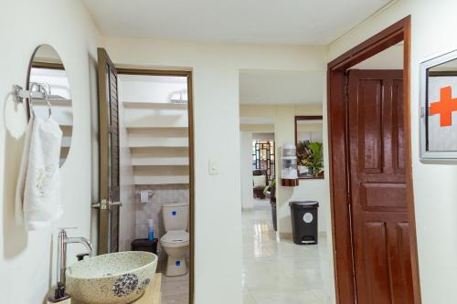a bathroom with a sink and a toilet at Casa Lilí Guaduas in Guaduas