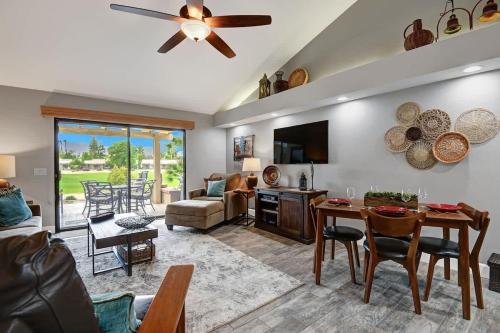 a living room with a table and a dining room at PL645 - Bay Hill Fairway - Alice Lodging in Palm Desert