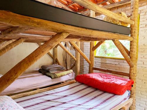 two bunk beds in a room with wooden ceilings at Canto da Águia in Ouro Preto