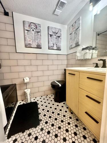 a bathroom with a sink and a toilet in it at Mid-Century Modern Beachfront in Flagler Beach