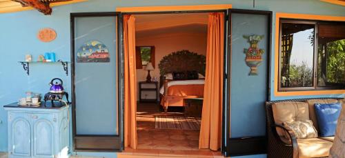 an open door to a bedroom with a bed at La Valise Los Cabos in Boca de la Vinorama