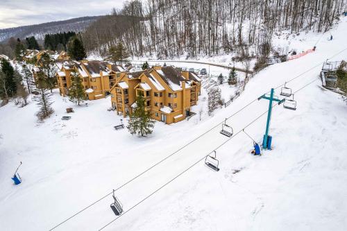 an aerial view of a ski resort with a ski lift at Cozy 1 Bedroom Condo Holiday Valley in Ellicottville
