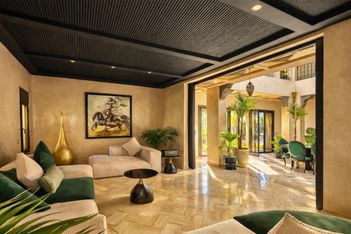 a living room with a couch and a table at Private Riad Alemania in Marrakesh - Pool - Rooftop in Marrakesh