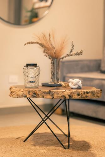 a table with a vase on top of it at Parallelo Loft Salento P1 in Salento