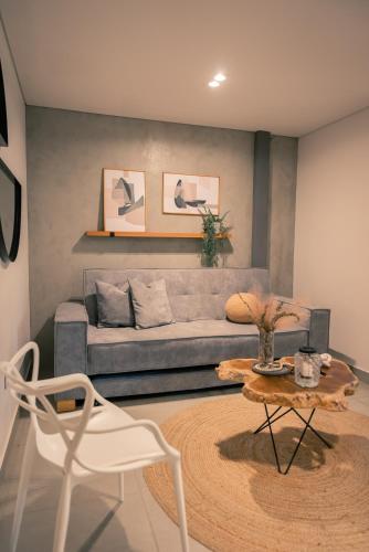 a living room with a couch and a table at Parallelo Loft Salento P1 in Salento