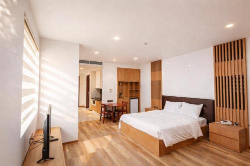 a bedroom with a bed and a television in it at Thúy Apartment Hải Phòng in Hai Phong