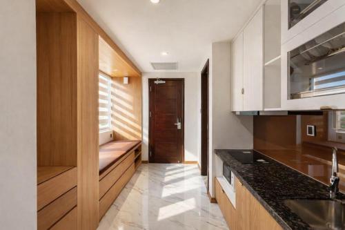 a kitchen with a sink and a counter top at Thúy Apartment Hải Phòng in Hai Phong