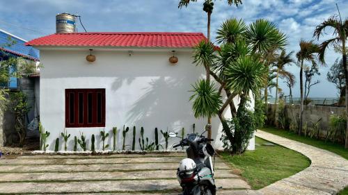 a motorcycle parked in front of a house at Beach Villas Phan Thiêt in Bình Sum