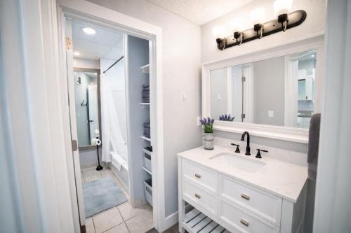a bathroom with a sink and a mirror at Aunt Beans Guest Suite in Kanab