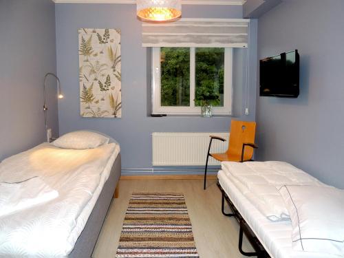 Postel nebo postele na pokoji v ubytování Hotell Munkeröd