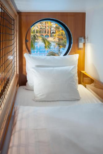 Voodi või voodid majutusasutuse Hotel Victory Therme Erding toas