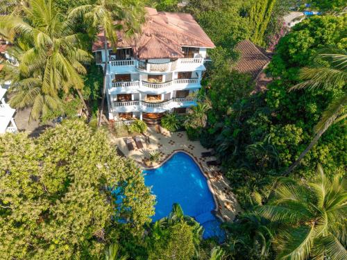 an aerial view of a resort with a swimming pool at Olive Hotel Alidia Beach Resort by Embassy Group in Baga
