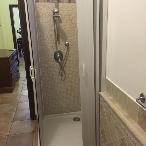 a shower with a glass door in a bathroom at Milordrelais in Massa Lubrense
