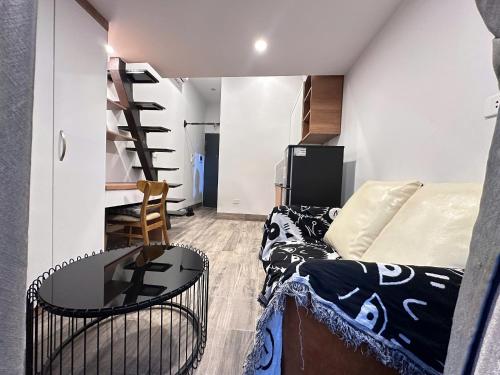 a living room with a couch and a table at Urban Nest - Đông Ngạc in Hanoi