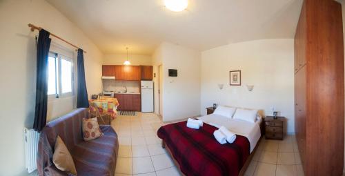 Ένα ή περισσότερα κρεβάτια σε δωμάτιο στο Casa Evriali Apartments