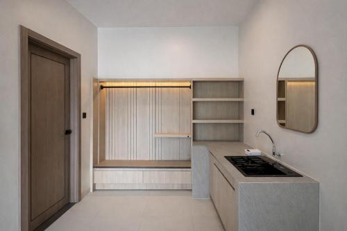 a kitchen with a sink and a counter top at Bene Residence in Maluk