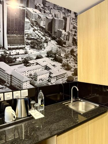 a kitchen with a black and white picture of a city at Kozi - Wilson Airport in Nairobi