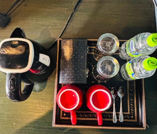a box with glasses and bottles on a table at Romance Valley Haputale in Haputale