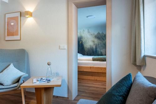 a room with a door to a bedroom with a bed at Karwendelnest in Maurach
