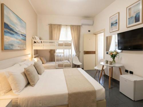 a bedroom with a bed and a bunk bed at Orange City Center in Tirana