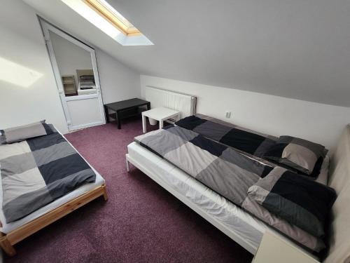 a bedroom with two beds and a mirror at Casa Campionilor in Hodoşa