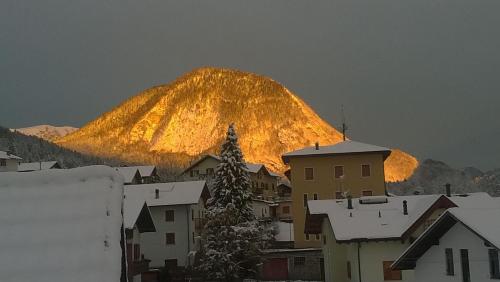 a mountain in the background of a city with a town at B&B Il Piccolo Principe room and breakfast in Bieno