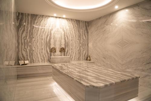 a bedroom with a large bed in a room at Wellwood Otel in Sapanca