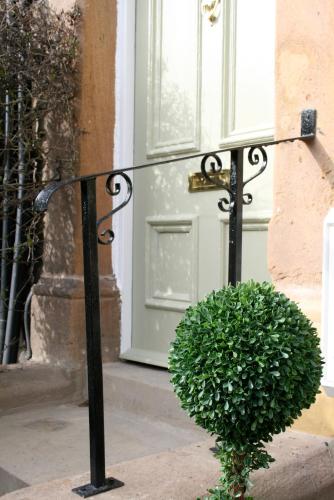 a plant sitting in front of a door at The Green House classic 2 bedroom apartment in Harrogate