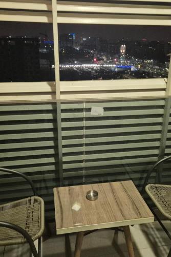 a table in front of a window with a view at AFI Discret Jacuzzi in Bucharest
