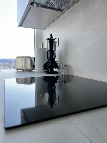 a kitchen counter with a coffee maker on top of it at Casa Cielo-Spectacular View-Center-Chic-Spacious in Liège