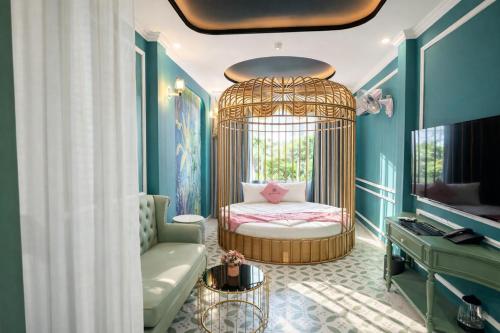 a room with a crib with a bed in it at New Pearl Hotel HCM in Ho Chi Minh City