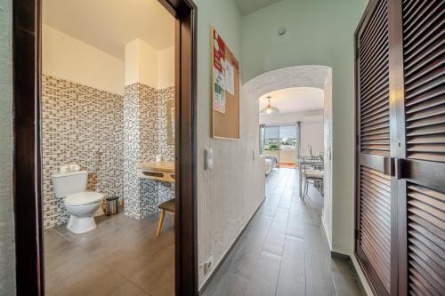 a bathroom with a toilet and a sink at Bellavista Jardim By BeGuest in Albufeira