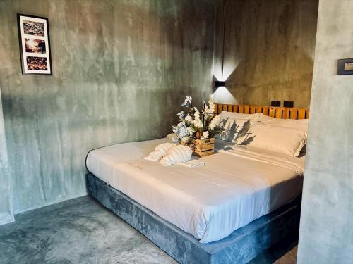 a bedroom with a bed with a christmas tree on it at Bangkok Phattanakan32 guest house in Bangkok