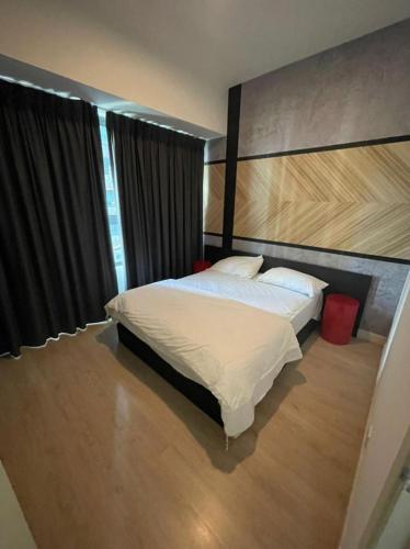 a bedroom with a large bed and a large window at Arte Plus Homestay Condo in Kuala Lumpur