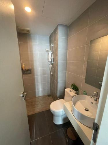 a bathroom with a toilet and a sink at Arte Plus Homestay Condo in Kuala Lumpur