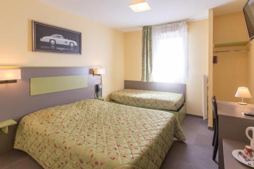 Postel nebo postele na pokoji v ubytování Pressoir Hôtel