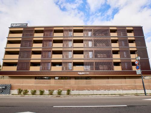 an apartment building on the side of a street at Rakuten STAY Awara Onsen in Awara