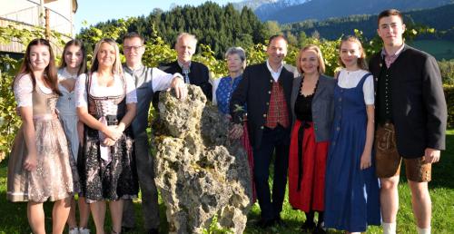 a group of people standing next to a rock at Landhotel Das Stocker in Vorderstoder