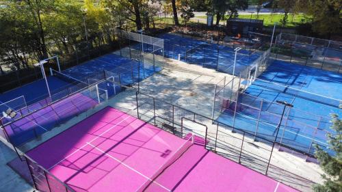 an overhead view of a swimming pool with pink and blue at Booking Hotel & Spa in Krakow