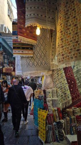 a group of people walking through a market at Hotel Marhaba - Beb Bhar Tunis in Tunis
