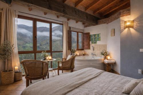 a bedroom with a large window and a tub and a bed at Carbayu Senda del Oso in Proaza