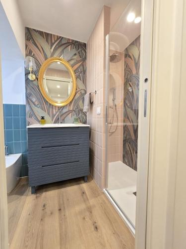 a bathroom with a sink and a mirror at Lovely Corner 2 in Porto Santo Stefano