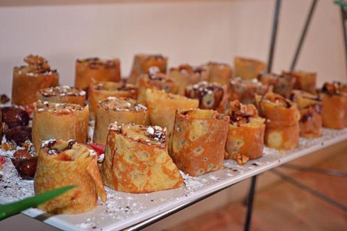 a tray of pastries sitting on top of a table at Le Rio Appart-Hotel City Center in Tangier