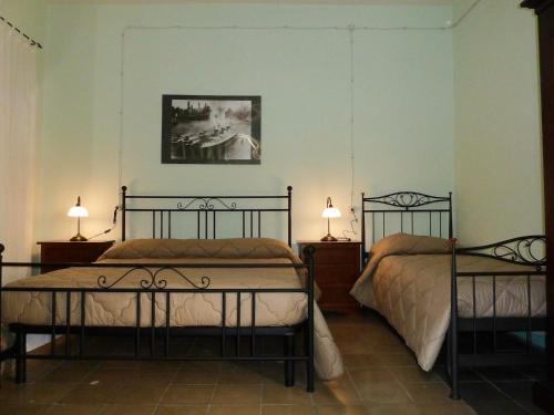 Posteľ alebo postele v izbe v ubytovaní La Casa dellAmericano - Casa d'epoca anni '30