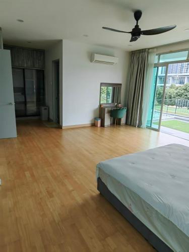 a bedroom with a bed and a wooden floor at Lakeside house in Gua Sai