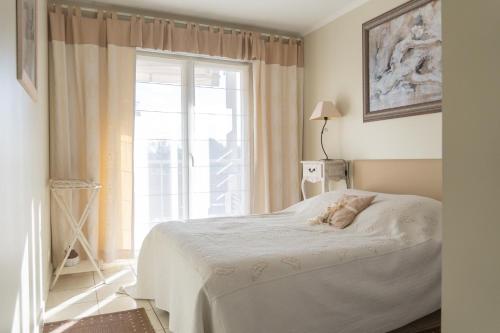 Llit o llits en una habitació de ZEN MARINA